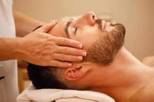 closeup-man-getting-head-massage-relaxing-with-eyes-closed-spa_637285-1721